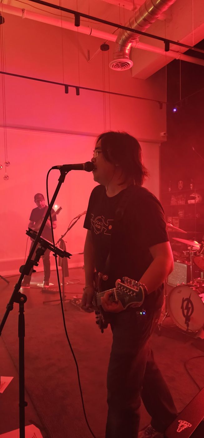 Singer at the mic in red light