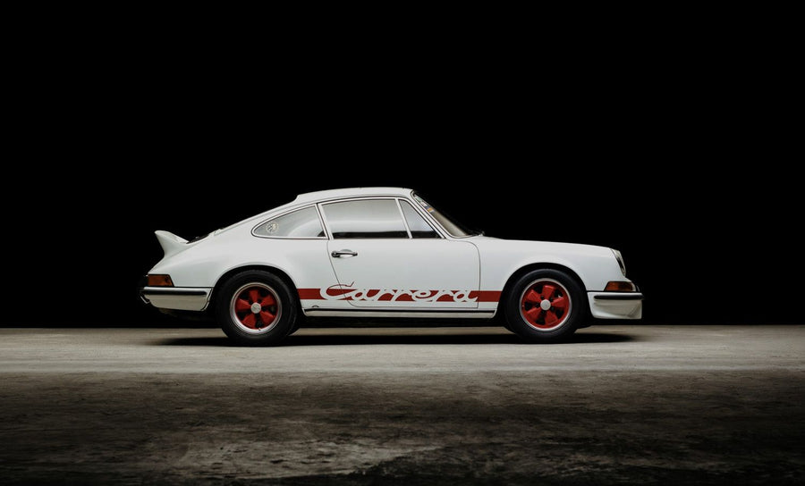 Classic with red wheels in a studio