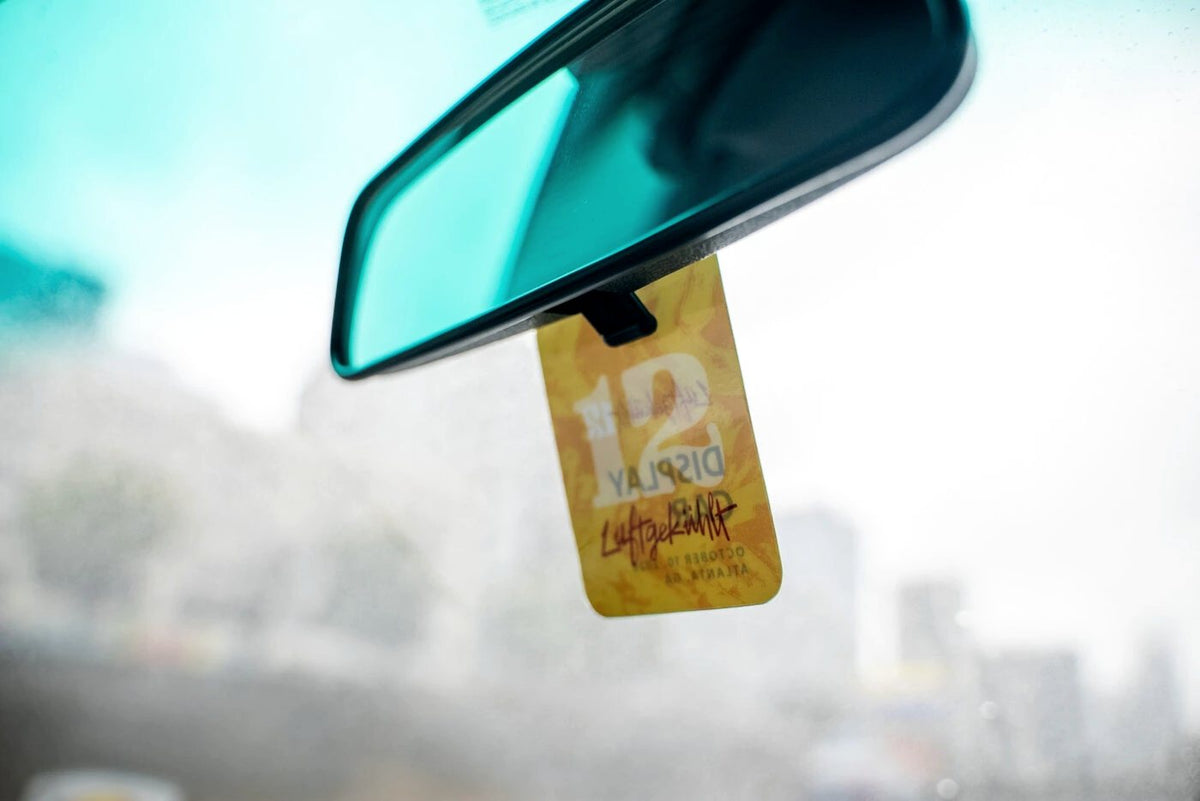 Event tag hanging from a rear view mirror